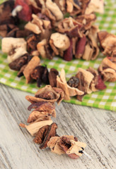 Dried mushrooms on wooden background