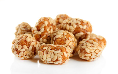 Tasty peanuts with sesame and caramel, isolated on white