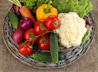 Fresh vegetables on burlap background
