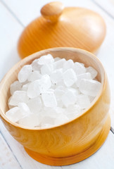 White sugar in the wooden vase