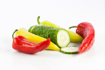 chilli and cucumber isolated on white background