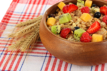 Oatmeal with fruits close-up
