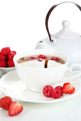 Cup of berry tea isolated on white