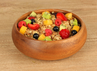Oatmeal with fruits on table close-up