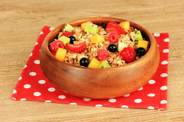 Oatmeal with fruits on table close-up