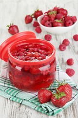 Home made berry jam on wooden table