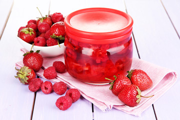 Home made berry jam on wooden table