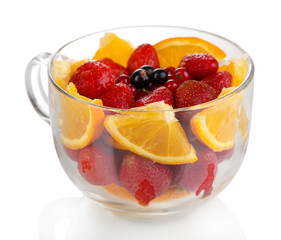 Useful fruit salad in glass cup isolated on white