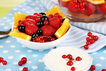 Useful fruit salad in glass cup and bowl