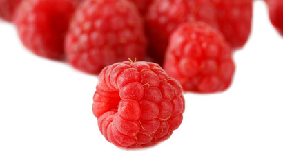 Ripe sweet raspberries isolated on white