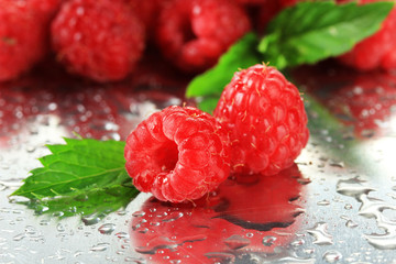 Ripe sweet raspberries with drops, close up