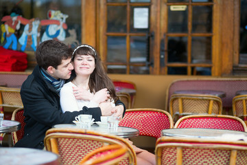 Loving couple in a Parisian cafe