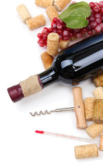 Bottle of wine, grapes and corks, isolated on white