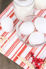 Ingredients for dough on wooden table close-up