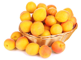 Fresh natural apricot in wicker basket isolated on white