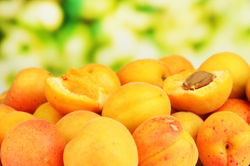 Naklejka na ściany i meble Fresh natural apricot on bright background