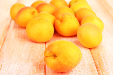 Fototapeta na wymiar Fresh natural apricot on wooden table