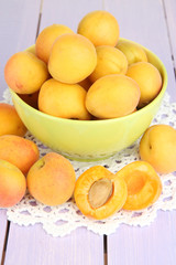 Naklejka na ściany i meble Fresh natural apricot in bowl on wooden table