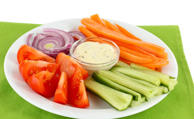 Assorted raw vegetables sticks in plate close up