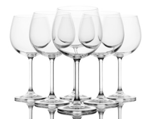 Empty wine glasses arranged and isolated on white