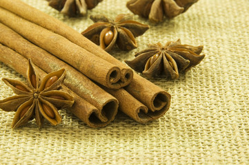 Cinnamon and Star Anise on hessian background