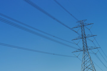 high voltage post with blue sky