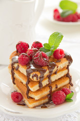 Waffles with raspberry, honey and chocolate.