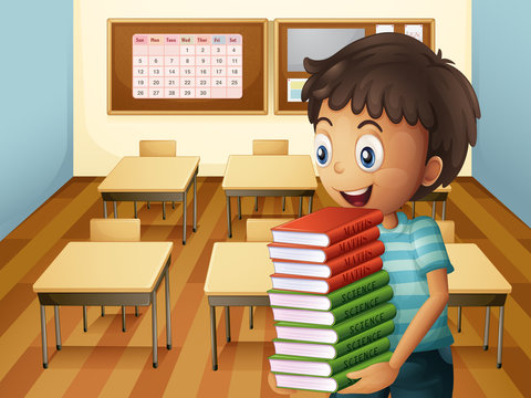 A boy carrying a pile of books