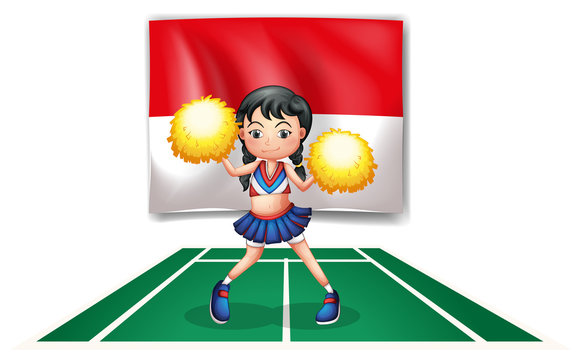 A cheerleader in front of the Indonesian Flag