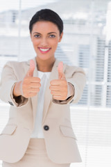 Businesswoman with thumbs up