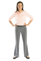 Confident Businesswoman Standing With Hands On Hips
