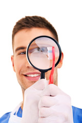 dentist with toothbrushes