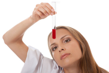 Test tube with blood sample in doctor hand, isolated