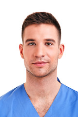 Fototapeta premium Young doctor man with crossed hands