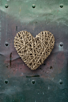 Wood heart on old metal background