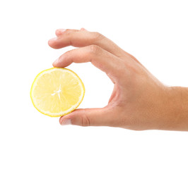 Hand holds lemon slice.