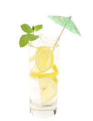 Full glass of water with lemon and mint.