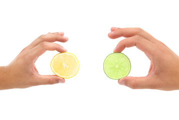 Slices lemon, lime and two hands.