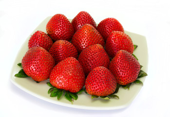 Fresh strawberries in a dish in white background
