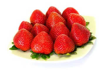 Fresh strawberries in a dish in white background