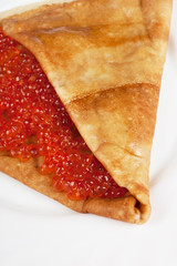 Pancake with red caviar