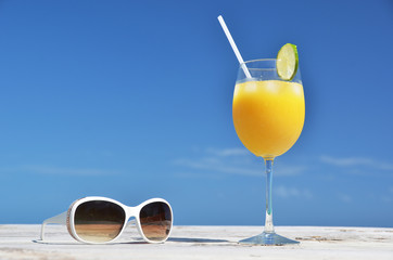 Orange juice and sunglasses