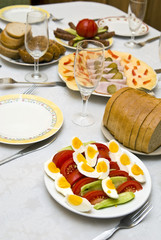 Festively covered table, with various dishes .