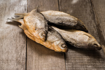 Dried fishes on wooden table