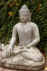Stone Buddha in the lotus position.