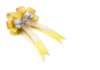 Shiny gold ribbon on white background with copy space.