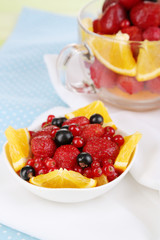Useful fruit salad in glass cup and bowl