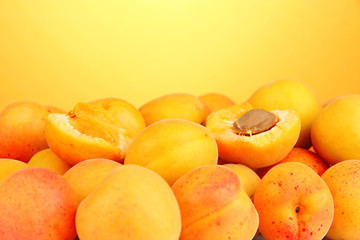Fresh natural apricot on orange background