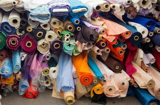 Bolts/rolls of various colored fabric