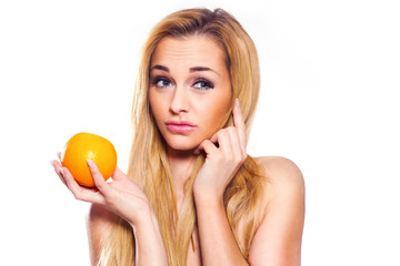 Healthy Lifestyle Woman holds orange. She is full of emotion.